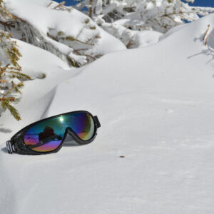 Sunglasses,On,Snow,Under,Fir,Twigs,Covered,By,Snow