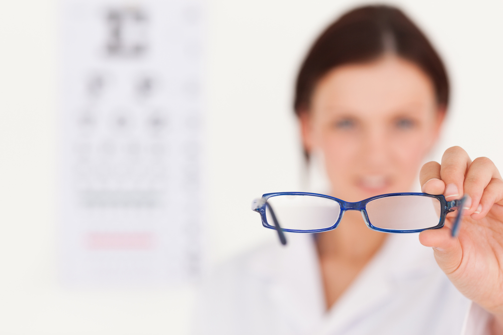 A,Blurred,Female,Optician,Showing,Glasses