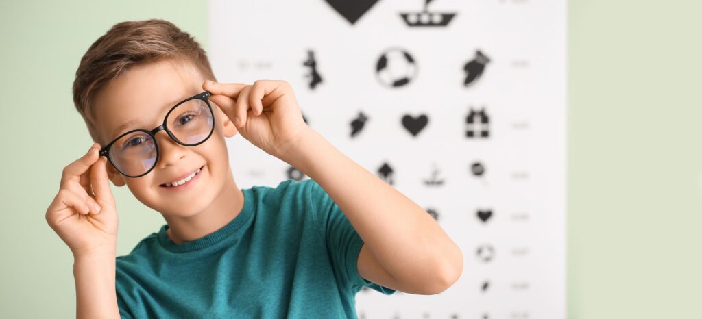 Little,Boy,Wearing,Glasses,At,Ophthalmologist's,Office