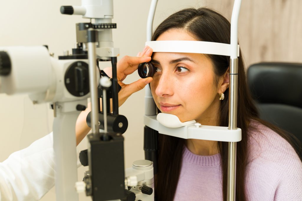 Latina,Woman,Getting,An,Eye,Exam,By,An,Ophthalmologist,Using
