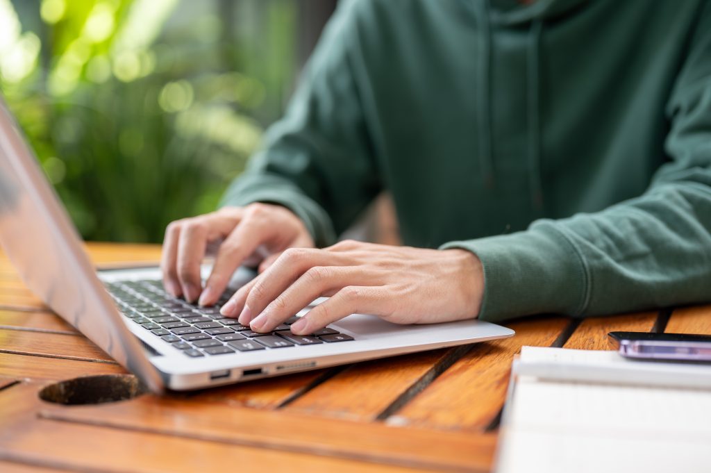 A,Cropped,Image,Of,A,Man,In,A,Green,Hoodie