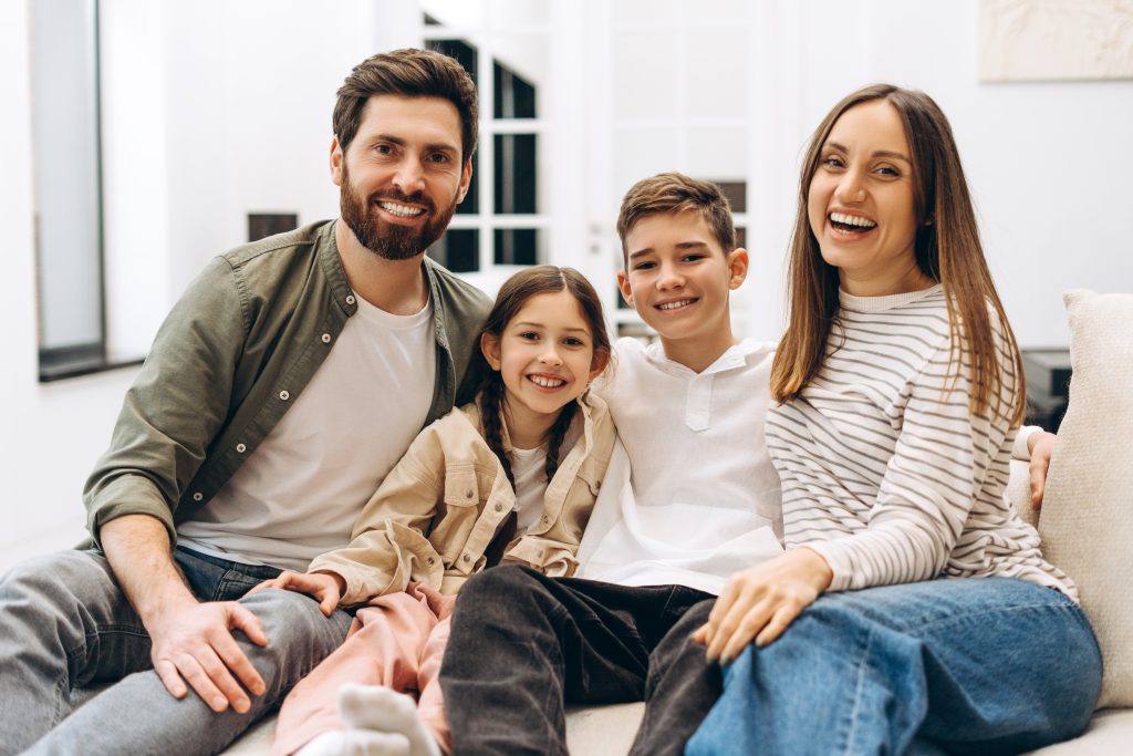 Happy,Family,Of,Four,,Mother,,Father,,Son,And,Daughter,,Are